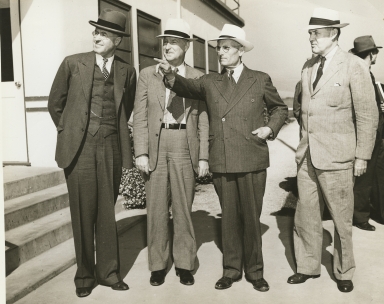 C.L. Preisker, General Thomas M. Robins, Capt. G. Allan Hancock, and unknown man (left to right)