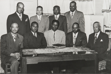 The early days in the Men's Department in the Olivet Baptist Church, Ventura : front l. to r.: I. Taylor, W. S. Moore, G. Watson, Willie Still, Fred Walker; Back L. to R.: W. T. Taylor, Deacon Wilson, Deacon Arnold and O. Edwards.