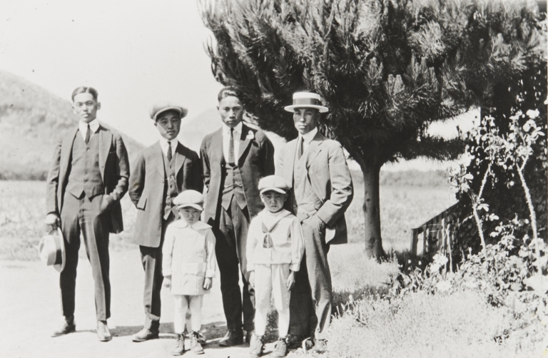 Three Japanese farm workers with Yoshio "George" Nagano and sons Patrick and William. Nagano Farm, Morro Bay : 1922.