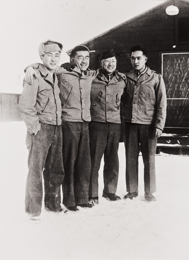Mr. Nakamura, Sam Rokutani, Mr. Nakamura and Patrick Nagano at Camp Savage, MN. : winter 1942 ; Rokutani and Nagano had been together at Camp 3, Poston Relocation Center ; the four trained at the U.S. Army Military Intelligence School ; Patrick Nagano served in the European theatre of operations in WWII, the other three in the Pacific.