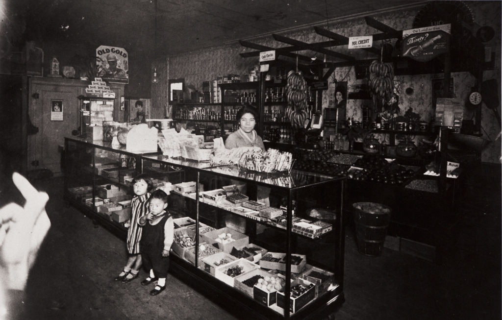 T. Moriwaki Store : 716 Oxnard Boulevard, Oxnard : 1931 ; Masano Moriwaki behind showcase ; children Masami and Noriyoshi.